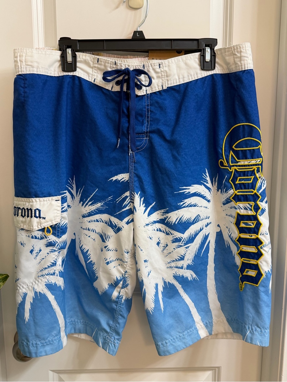 Vintage Men’s Corona Blue and White Palm-Print Board Shorts Size Lg